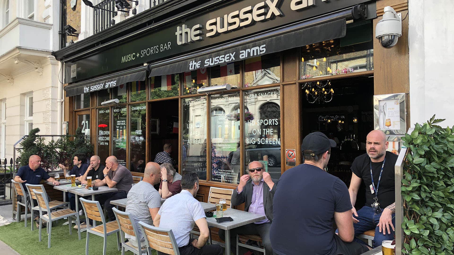 best-place-to-stay-in-london-for-tourists-patrons-outside-the-sussex-arms-pub-in-paddington